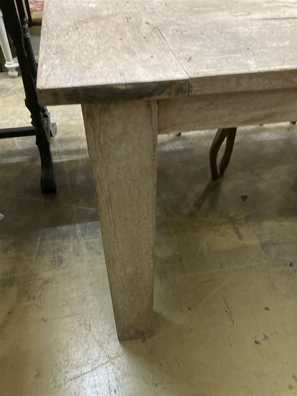 A large rectangular weathered teak garden table, width 220cm, depth 99cm, height 79cm